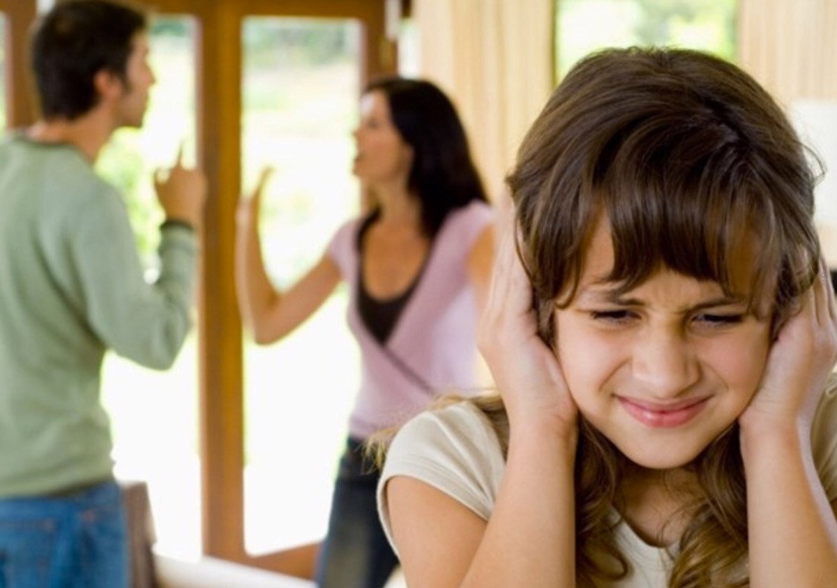 Parents argue while child covers ears