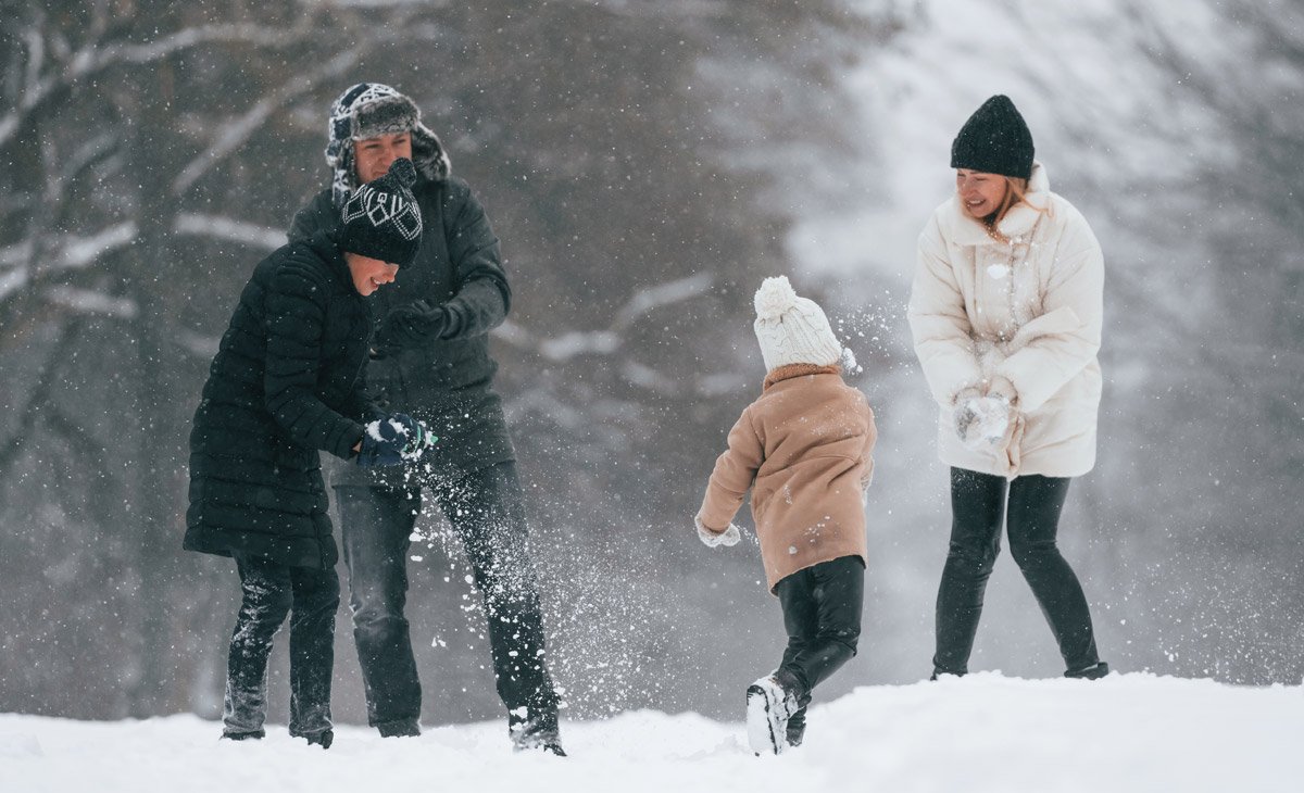 Family playing in the snow